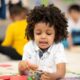 Child plaing with toy