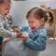 Two kids fight for a toy