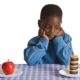 a kid picking which snack he want to eat